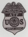 The Bureau of ATF badge (Dept. of Justice).
