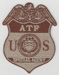 The Bureau of ATF badge (Dept. of Justice), desert colors.